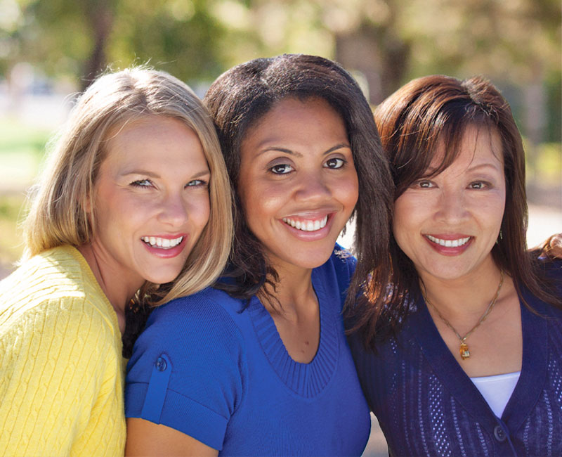 three smiling ladies