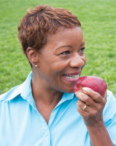 Woman eating an apple